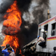 Dark thick smoke billows from the fire after a commuter train collided with a truck hauling fuel on the outskirts Jakarta